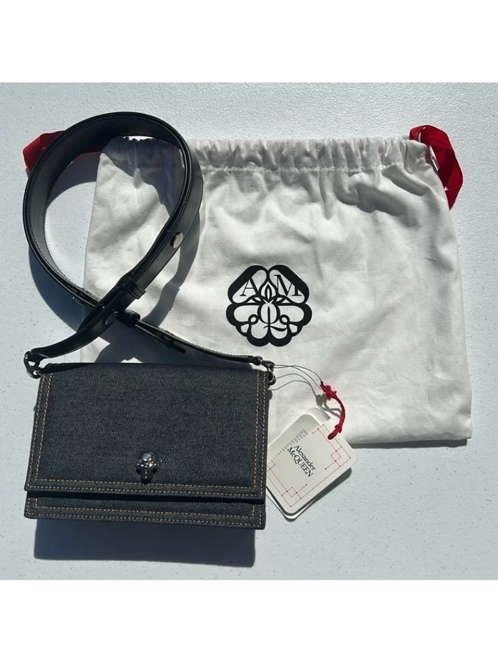 New pre-authenticated Alexander McQueen skull denim bag with dust bag